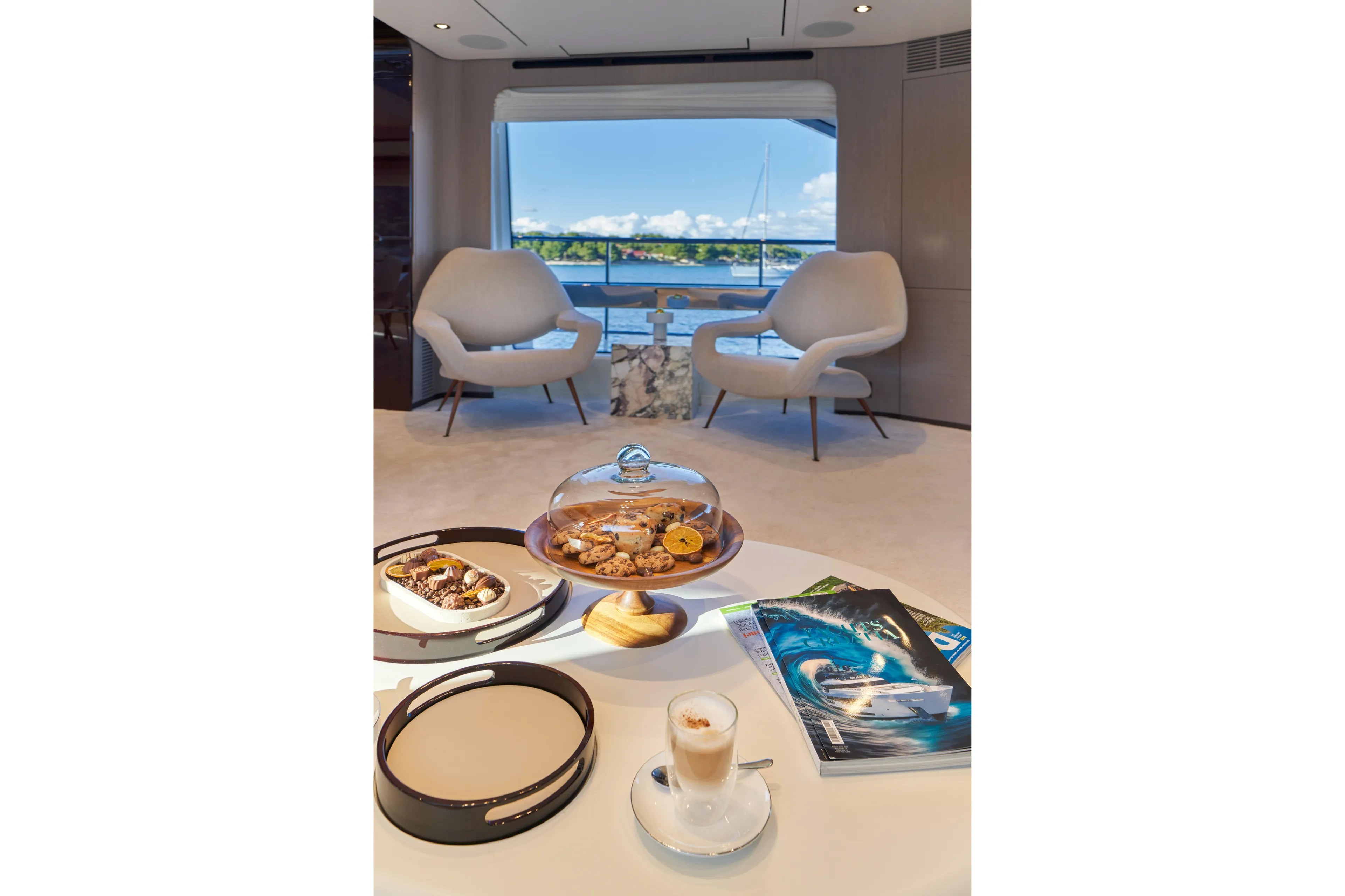 Aluminia Too Yacht Photos Pics Luxurious interior of 2024 Azimut Grande 27M yacht with elegant seating and refreshments.