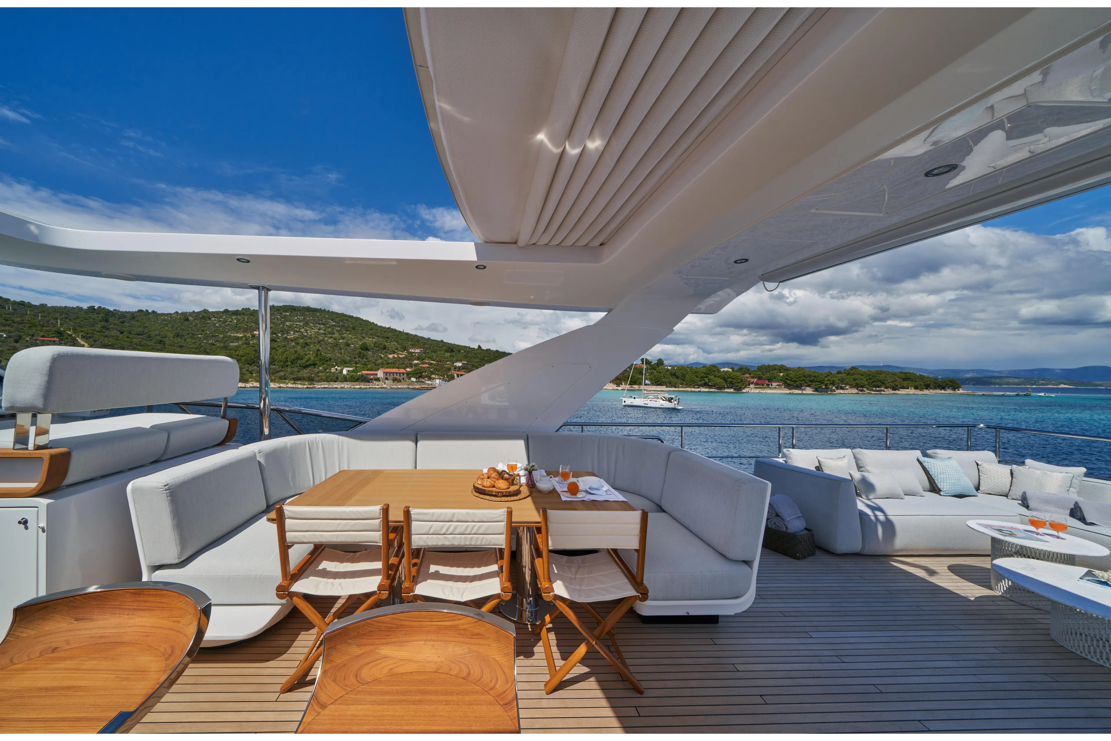 Aluminia Too Yacht Photos Pics Luxurious deck of 2024 Azimut Grande 27M yacht with elegant seating and ocean view.