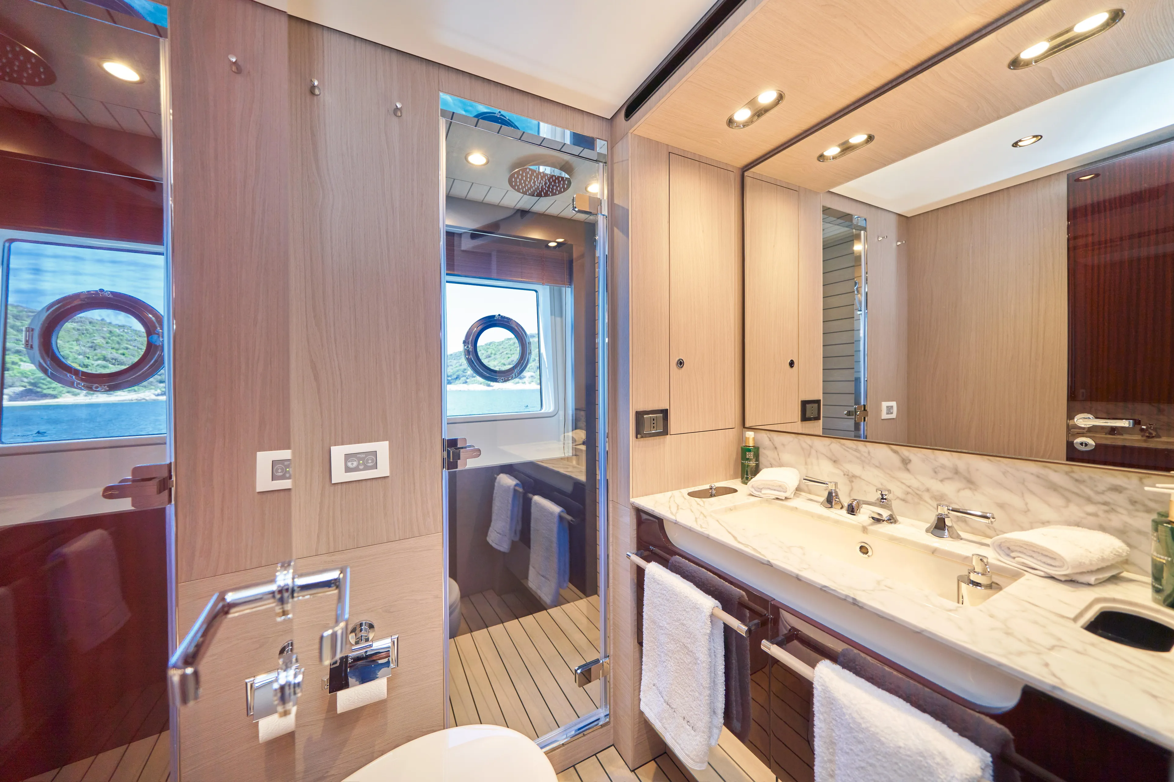 Aluminia Too Yacht Photos Pics Luxurious bathroom interior of 2024 Azimut Grande 27M yacht, featuring elegant fixtures and wood accents.