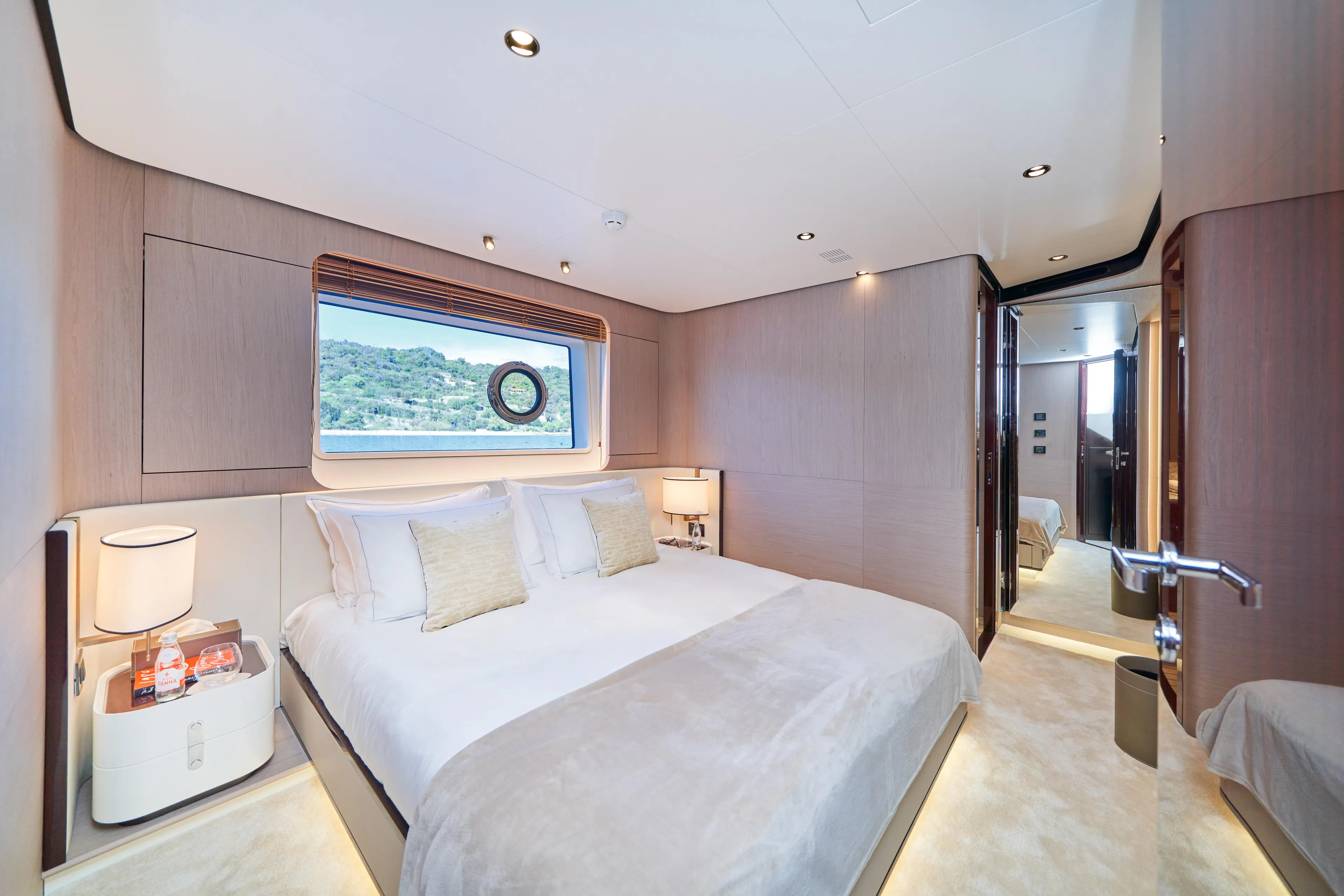Aluminia Too Yacht Photos Pics Luxurious bedroom interior of 2024 Azimut Grande 27M yacht with elegant decor and scenic window view.
