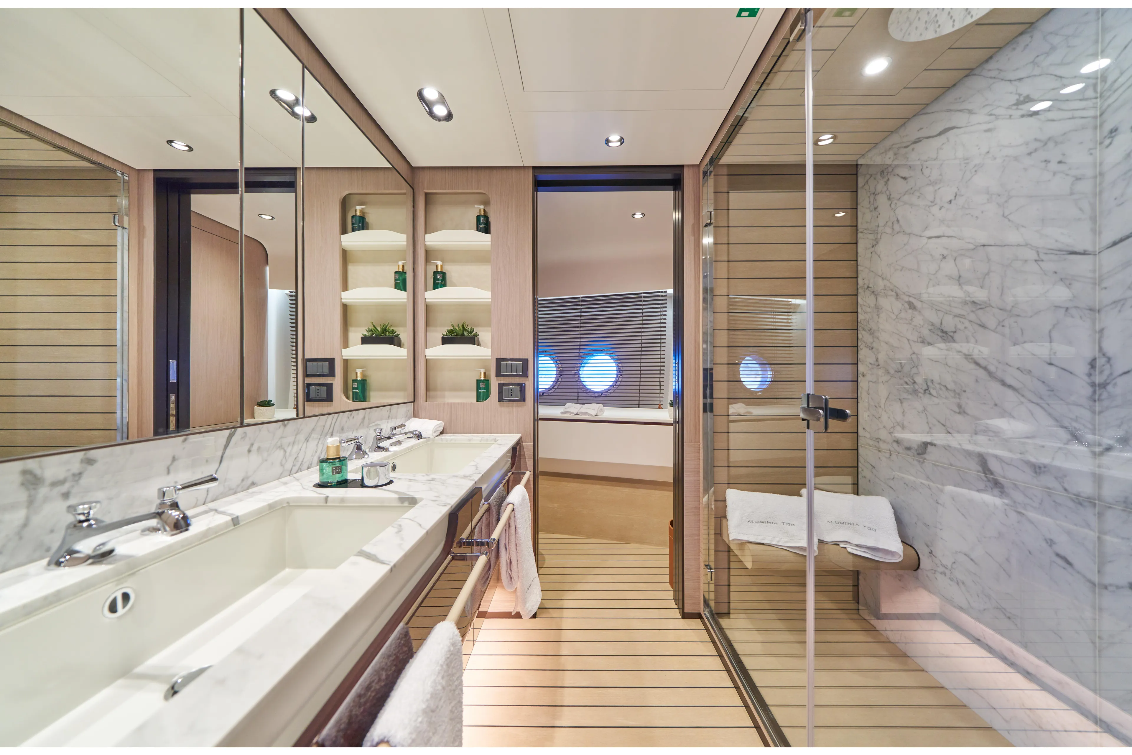 Aluminia Too Yacht Photos Pics Luxurious bathroom in 2024 Azimut Grande 27M yacht with marble accents and modern fixtures.