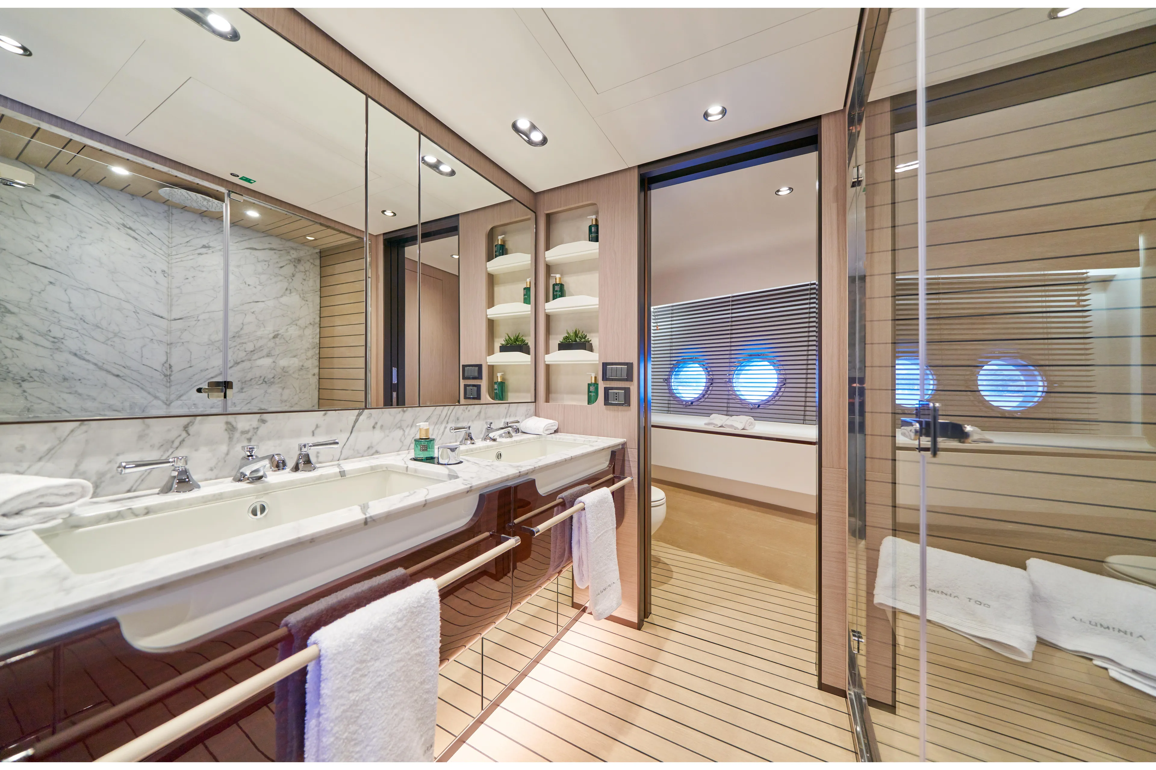 Aluminia Too Yacht Photos Pics Luxurious bathroom in 2024 Azimut Grande 27M yacht with marble accents and modern fixtures.