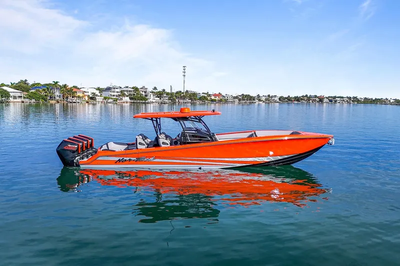  Yacht Photos Pics 2026 Nor-Tech 390 Sport Center Console boat on calm water, vibrant orange design.