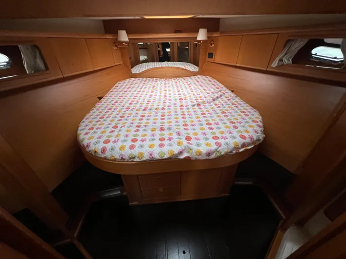  Yacht Photos Pics 2007 Cantieri Estensi Goldstar 440 cabin with cozy bed and wooden interior.