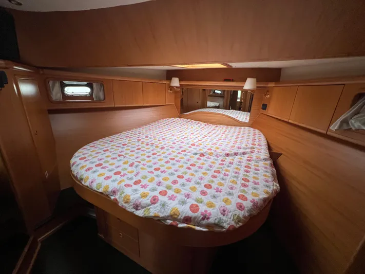  Yacht Photos Pics Cozy bedroom in 2007 Cantieri Estensi Goldstar 440 yacht with colorful bedding.