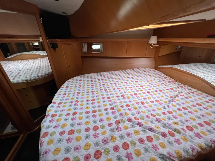  Yacht Photos Pics Cozy bedroom in 2007 Cantieri Estensi Goldstar 440 yacht with colorful bedding.