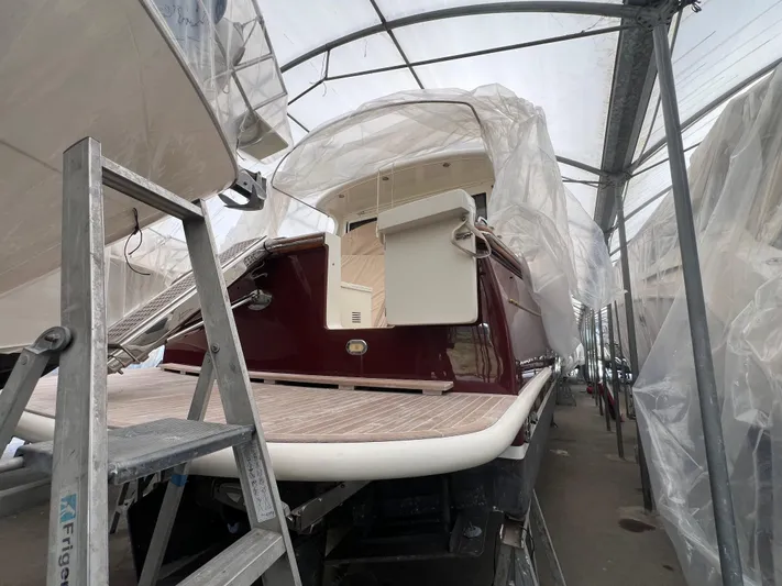  Yacht Photos Pics 2007 Cantieri Estensi Goldstar 440 yacht under protective cover in storage facility.