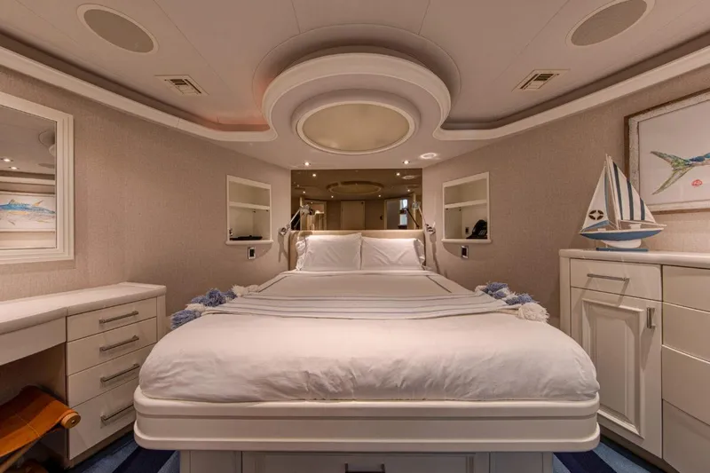 Spirit Yacht Photos Pics Luxurious bedroom interior of 2010 Westport 112 yacht with elegant decor and comfortable bedding.