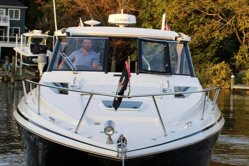 Gratitude Yacht Photos Pics 2015 Regal 35 Sport Coupe boat cruising on a calm waterway.