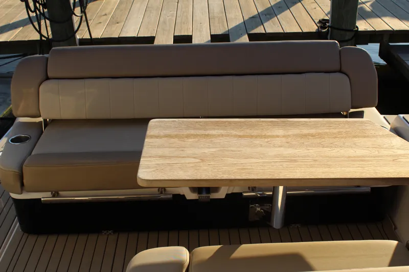 Gratitude Yacht Photos Pics 2015 Regal 35 Sport Coupe interior with beige seating and wooden table.