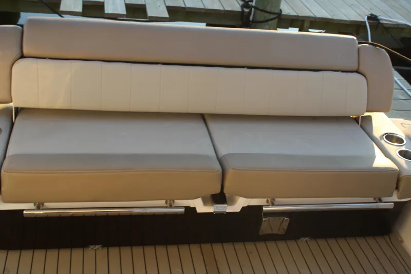 Gratitude Yacht Photos Pics 2015 Regal 35 Sport Coupe boat seating with beige cushions and cup holders.