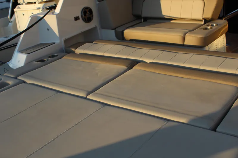 Gratitude Yacht Photos Pics Luxurious seating area on a 2015 Regal 35 Sport Coupe boat, featuring beige upholstery.