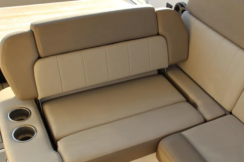 Gratitude Yacht Photos Pics Beige leather seating with cup holders on a 2015 Regal 35 Sport Coupe boat.