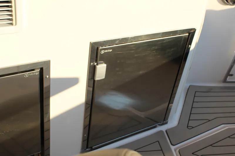 Gratitude Yacht Photos Pics 2015 Regal 35 Sport Coupe interior with stainless steel fridge doors.