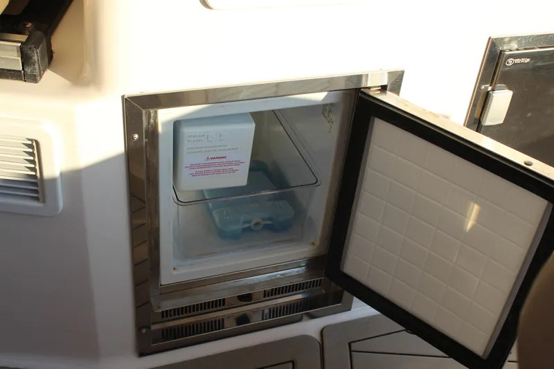 Gratitude Yacht Photos Pics Open ice maker compartment on 2015 Regal 35 Sport Coupe boat.