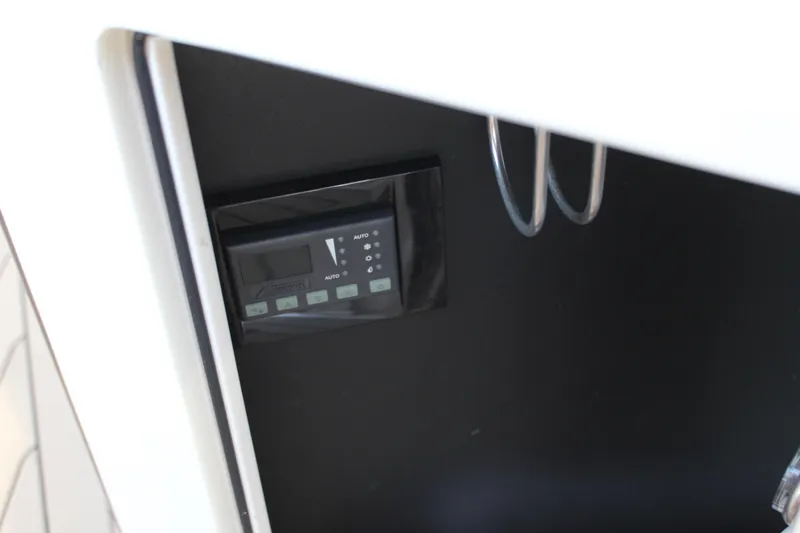 Gratitude Yacht Photos Pics Control panel inside 2015 Regal 35 Sport Coupe boat, featuring digital display and buttons.