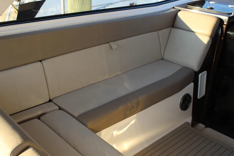 Gratitude Yacht Photos Pics Luxurious seating area in a 2015 Regal 35 Sport Coupe boat interior.