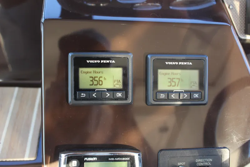 Gratitude Yacht Photos Pics Volvo Penta engine hour meters on 2015 Regal 35 Sport Coupe dashboard, showing 356 and 357 hours.