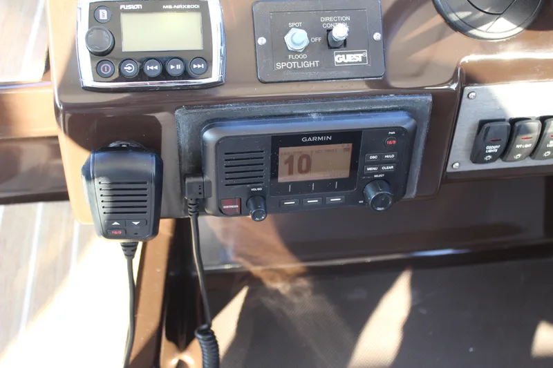 Gratitude Yacht Photos Pics Control panel of a 2015 Regal 35 Sport Coupe with Garmin and Fusion devices.