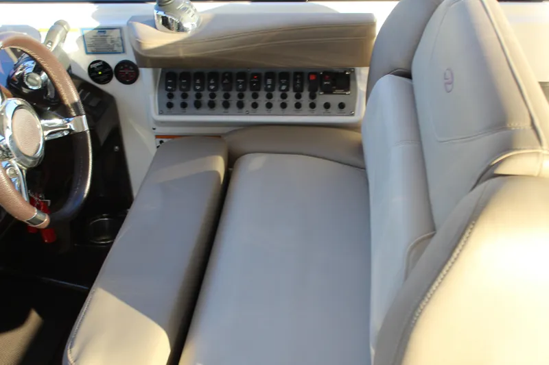 Gratitude Yacht Photos Pics Interior of 2015 Regal 35 Sport Coupe with steering wheel and control panel.