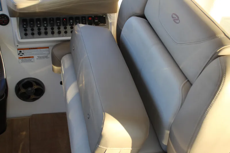 Gratitude Yacht Photos Pics 2015 Regal 35 Sport Coupe interior with beige seating and control panel.