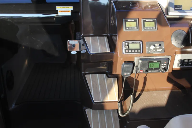 Gratitude Yacht Photos Pics Control panel of a 2015 Regal 35 Sport Coupe boat with navigation equipment.