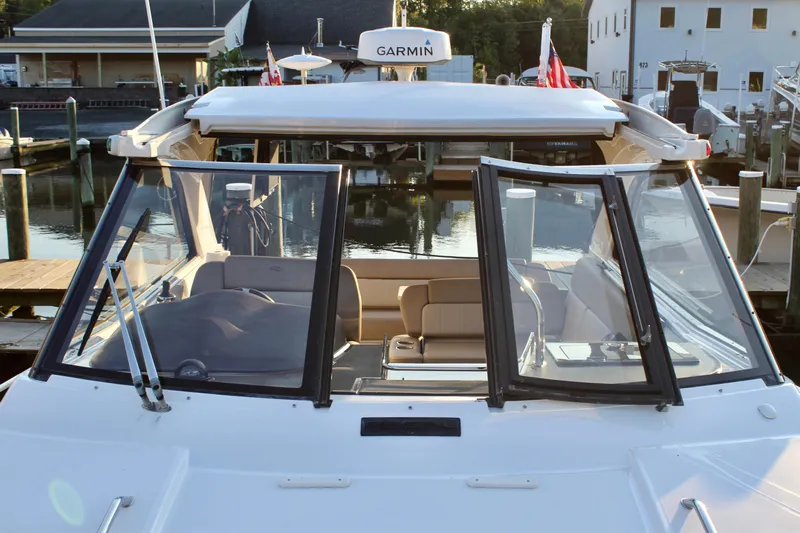 Gratitude Yacht Photos Pics 2015 Regal 35 Sport Coupe boat docked at marina, featuring open cockpit and Garmin equipment.