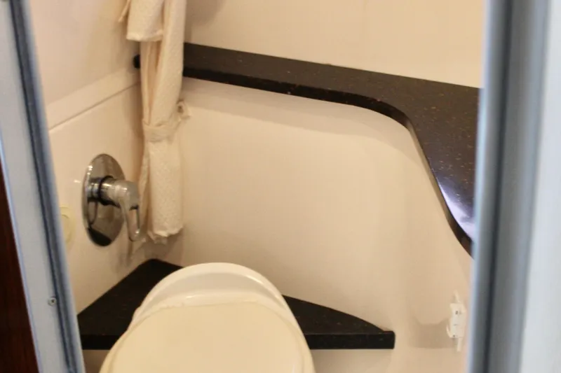 Gratitude Yacht Photos Pics Bathroom interior of 2015 Regal 35 Sport Coupe with modern fixtures and countertop.