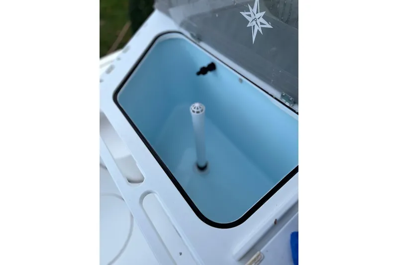  Yacht Photos Pics Livewell compartment on 2025 NorthCoast 285 HT boat, featuring a sleek design.