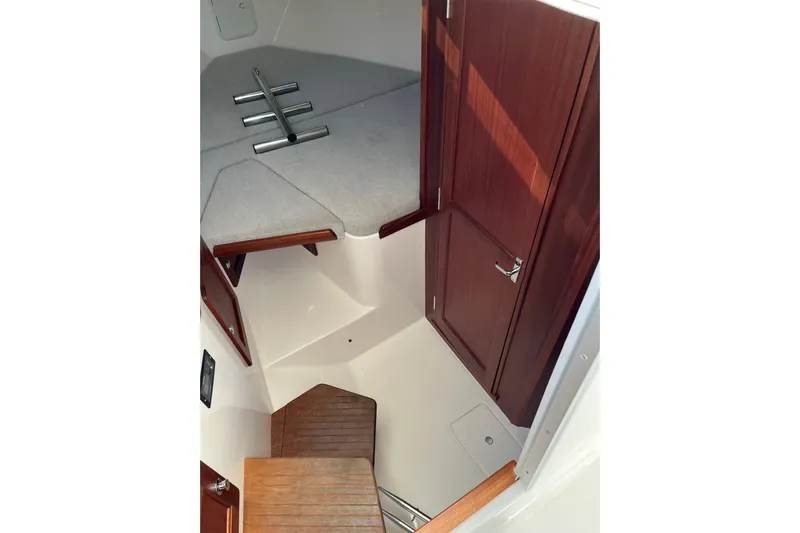  Yacht Photos Pics Interior of 2025 NorthCoast 285 HT boat with wooden accents and seating area.