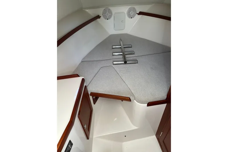  Yacht Photos Pics 2025 NorthCoast 285 HT cabin interior with cushioned seating and wooden accents.