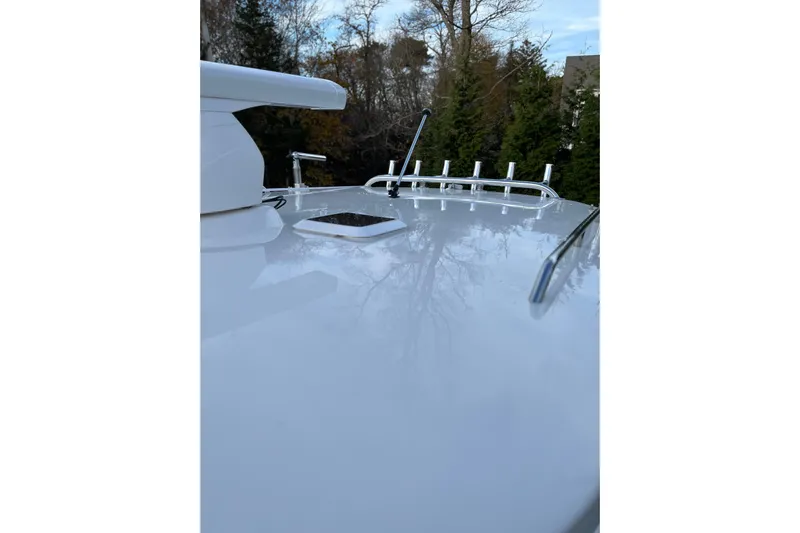  Yacht Photos Pics Rooftop view of 2025 NorthCoast 285 HT boat with rod holders and hatch.