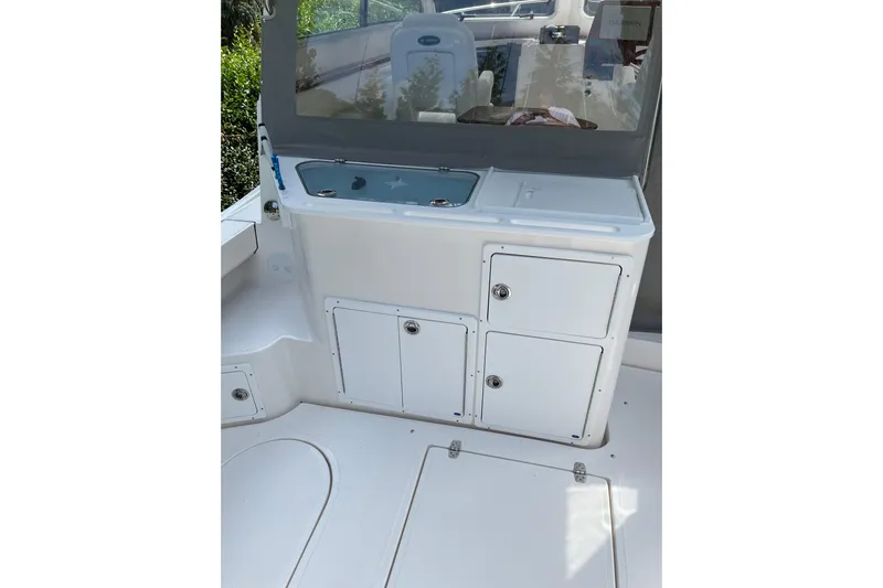  Yacht Photos Pics 2025 NorthCoast 285 HT boat interior with storage compartments and sink.