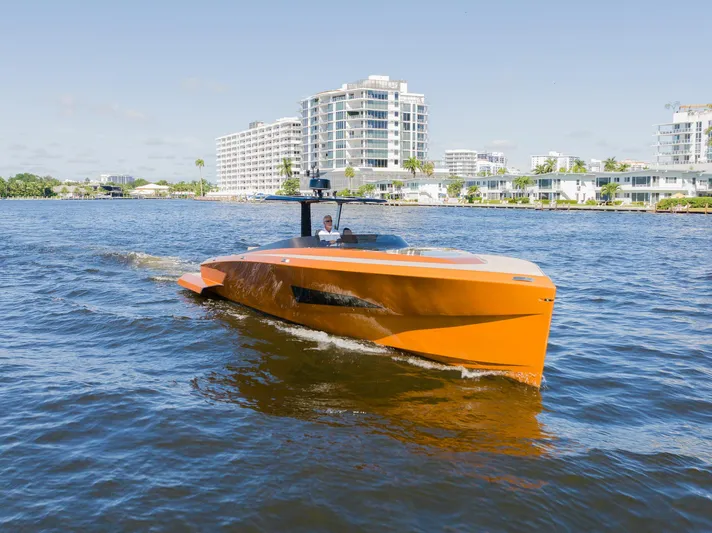  Yacht Photos Pics 2022 SAY Carbon Yachts 42 Open cruising on water near modern buildings.