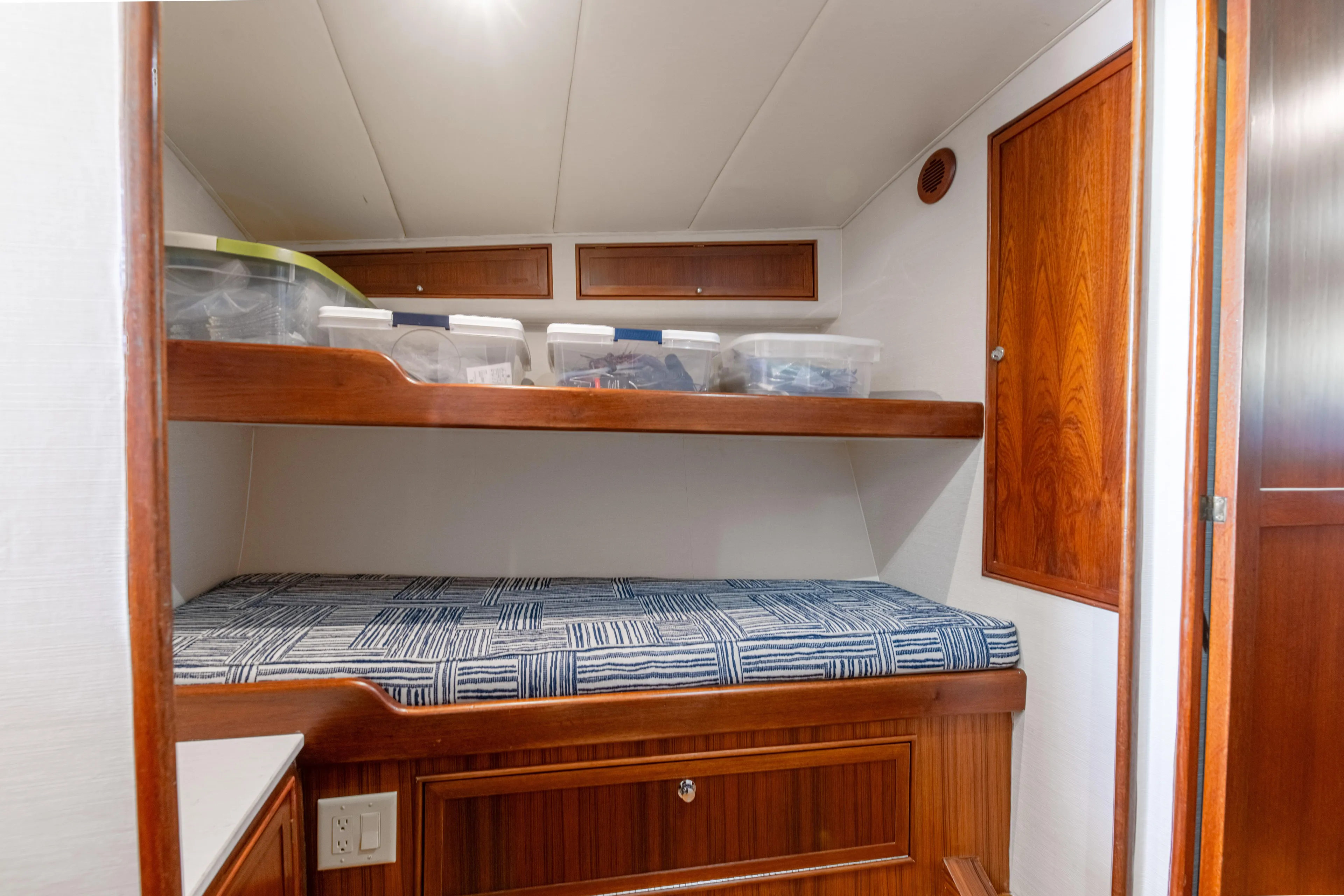 Megabite Yacht Photos Pics 1984 Custom Carolina Scarborough boat cabin with wooden bunk beds and storage.