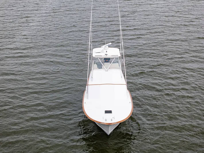 Megabite Yacht Photos Pics 1984 Custom Carolina Scarborough boat on open water, aerial front view.