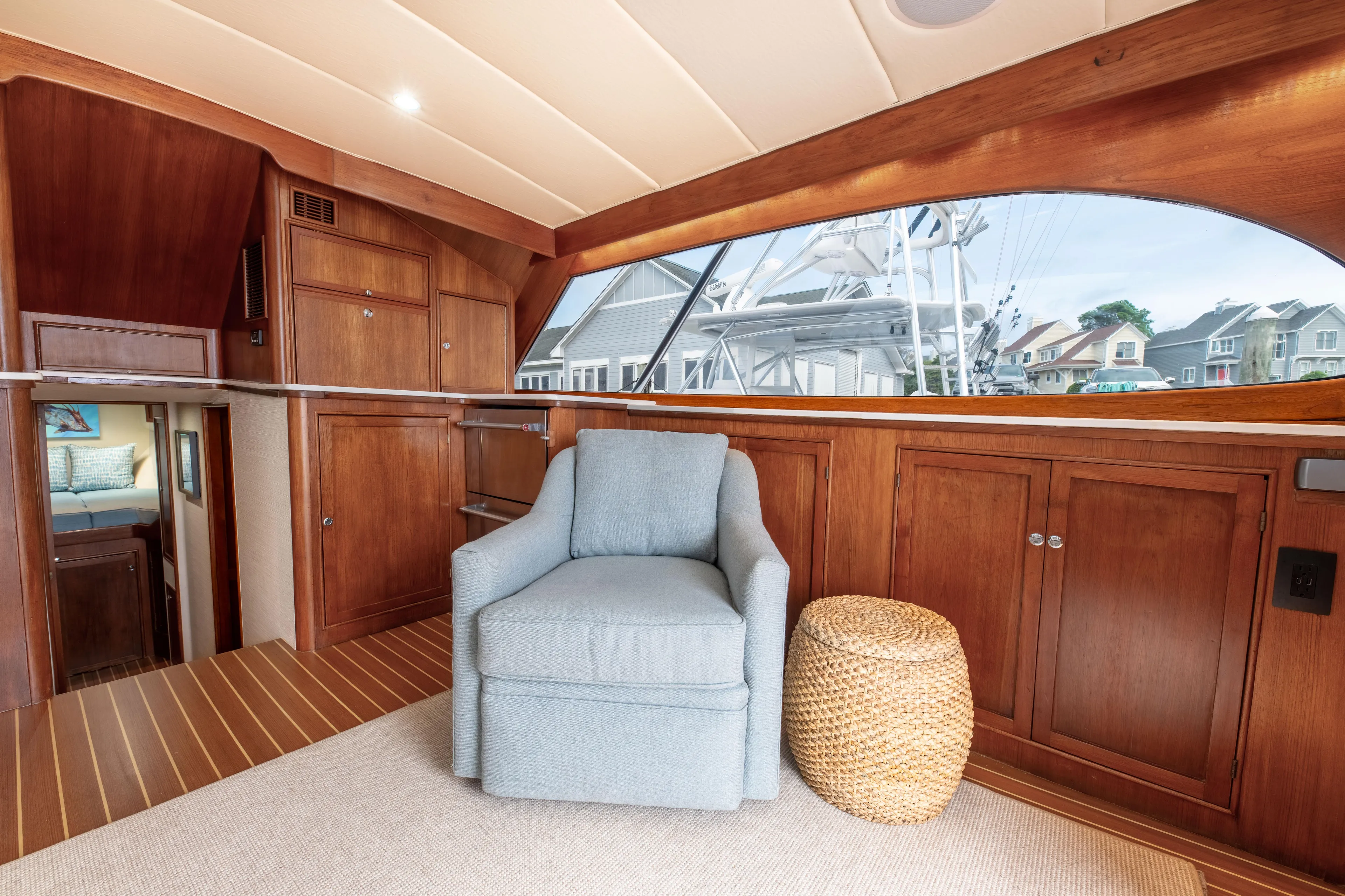 Megabite Yacht Photos Pics Luxurious 1984 Custom Carolina Scarborough yacht interior with wooden cabinetry and cozy seating.