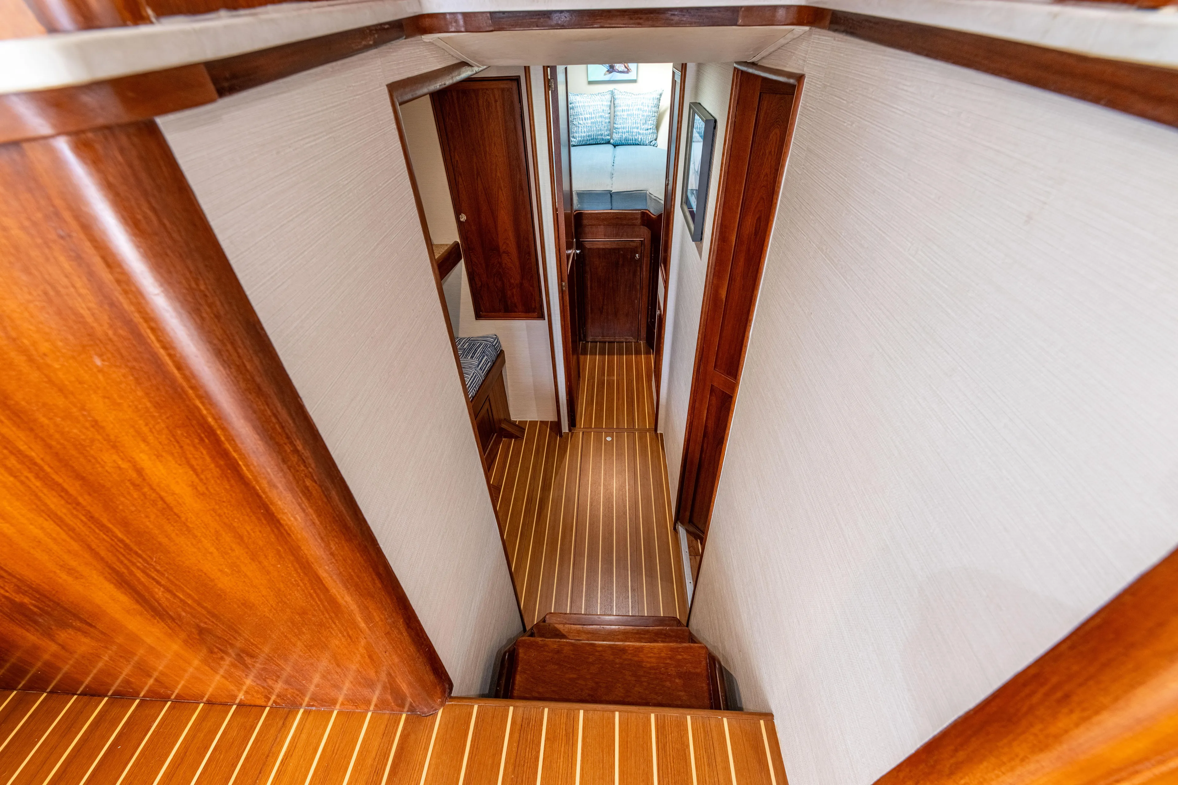 Megabite Yacht Photos Pics Interior of 1984 Custom Carolina Scarborough boat with wooden flooring and hallway view.