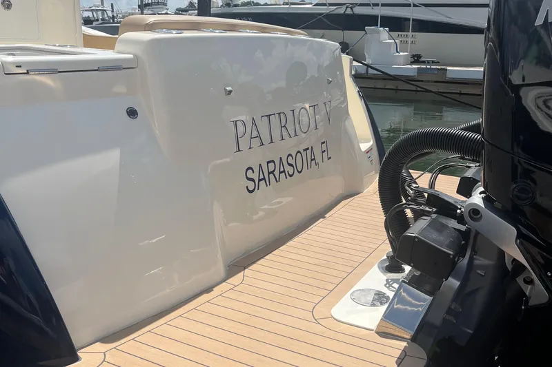  Yacht Photos Pics 2024 Scout 330 LXF boat docked, featuring "Patriot V" from Sarasota, FL.