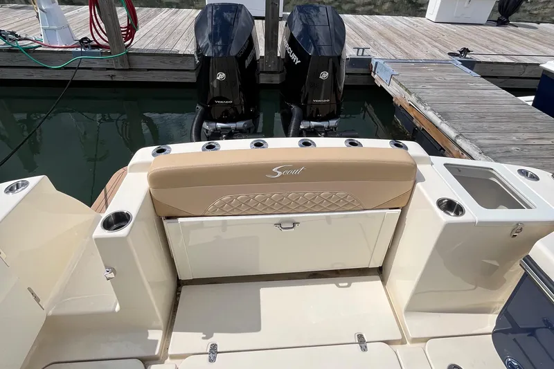  Yacht Photos Pics 2024 Scout 330 LXF boat with dual Mercury engines at dock.