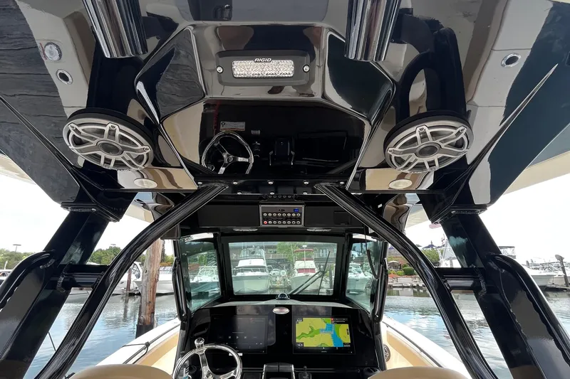  Yacht Photos Pics 2024 Scout 330 LXF boat interior with advanced navigation system and speakers.