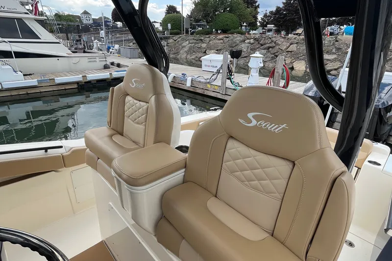  Yacht Photos Pics 2024 Scout 330 LXF boat seats with quilted design at marina.