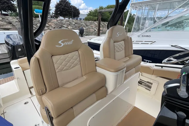  Yacht Photos Pics 2024 Scout 330 LXF boat interior with luxurious tan seating and elegant design.