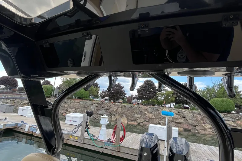  Yacht Photos Pics 2024 Scout 330 LXF boat interior with dock view and equipment.