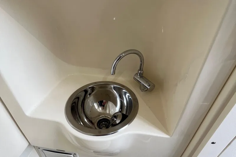  Yacht Photos Pics Stainless steel sink in 2024 Scout 330 LXF boat interior.