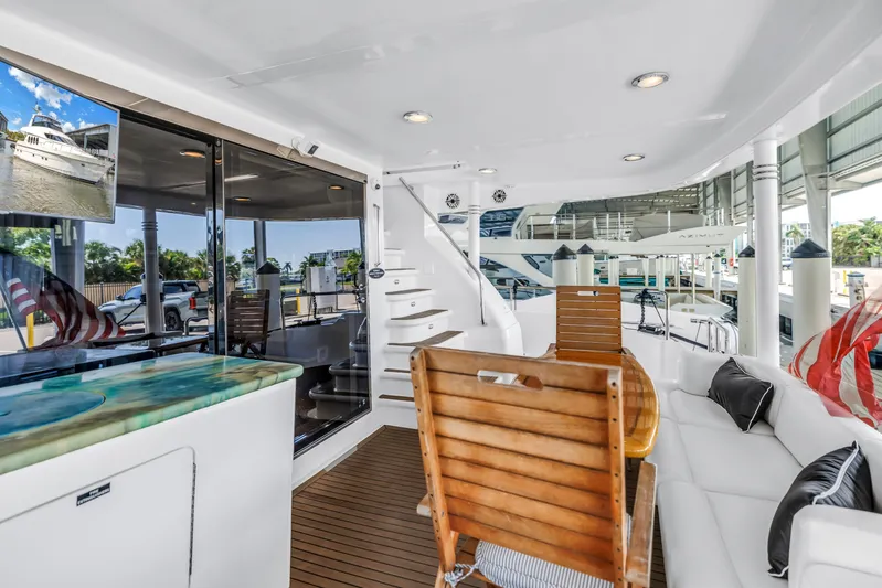  Yacht Photos Pics Luxurious 2000 Neptunus 65 Flybridge yacht interior with elegant seating and modern design.