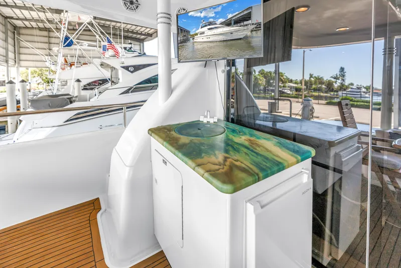  Yacht Photos Pics Luxurious Neptunus 65 Flybridge yacht interior with elegant countertop and modern amenities, year 2000 model.