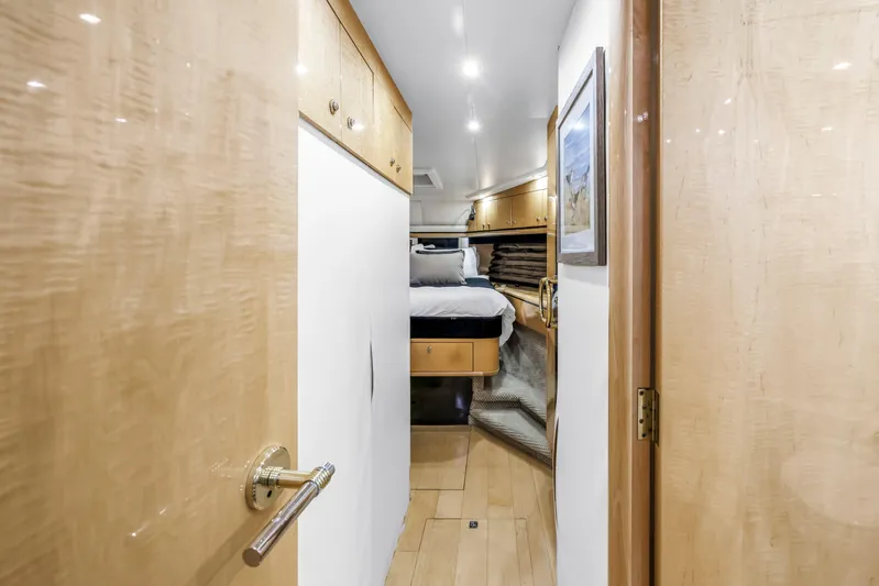  Yacht Photos Pics Luxurious cabin interior of 2000 Neptunus 65 Flybridge yacht, featuring elegant wood finishes.