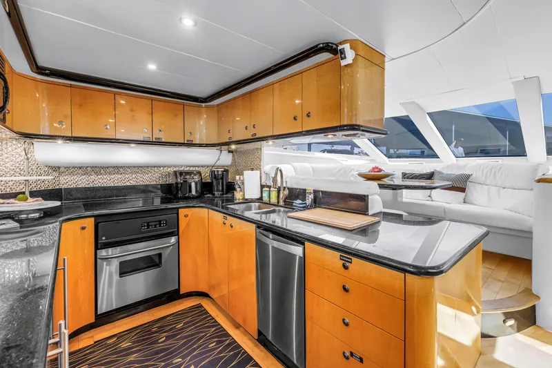  Yacht Photos Pics Luxurious kitchen interior of 2000 Neptunus 65 Flybridge yacht with modern amenities.