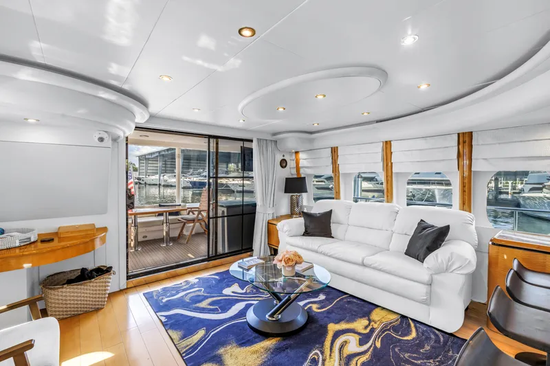  Yacht Photos Pics Luxurious Neptunus 65 Flybridge yacht interior, featuring elegant seating and stylish decor, year 2000.